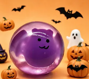 Detailed view of purple Halloween bat squishy toy with spooky pumpkin background