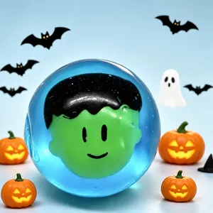 Close-up of a blue translucent squeeze toy featuring a green monster head inside