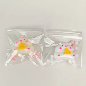 Detail showing plush hamster stress relief toys in transparent zip-lock packaging.