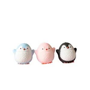 Close-up of three colorful cute penguin squishy toys for stress relief and slow rebound