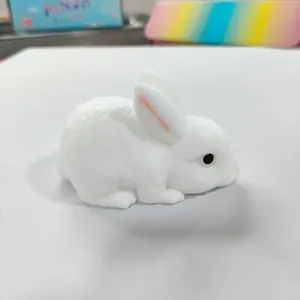 Detailed side profile of a soft white rabbit squishy toy with realistic fuzzy texture