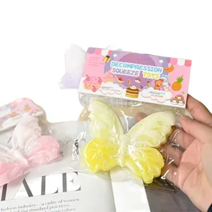 Detailed view of butterfly shaped silicone decompression squeeze toy in its retail packaging