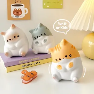 Three cute PU slow rebound cat squeeze toys for stress relief in a cozy home setting