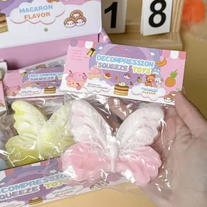 Close-up detail of butterfly-shaped silicone squishy toy in cute macaron colors