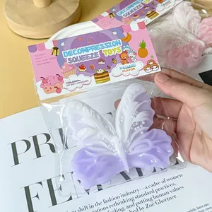 Close-up of a purple and white butterfly decompression squeeze toy in packaging
