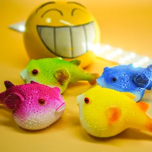 Detailed view of colorful textured blowfish squishy toys in four vibrant neon colors.