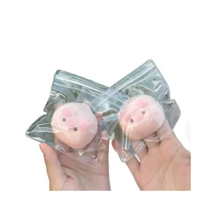 Close-up of cute pink pig silicone squeeze toys in clear packaging for stress relief