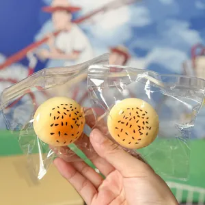 Detail of fluid egg yolk pastry squishy toys in clear packaging for stress relief.