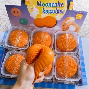 Detailed close-up showing the soft squishy texture of orange mooncake stress relief toy