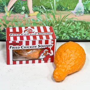 Detailed view of a jumbo fried chicken leg squishy toy with its red and white box packaging