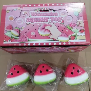 Detailed view of watermelon squishy toys with colorful retail packaging box