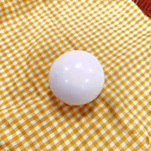 Macro view of a white slow-rebound squeeze toy with a smooth TPR texture