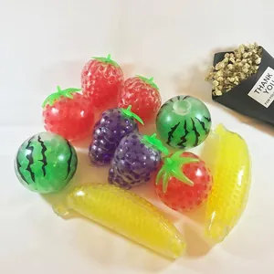 Variety of colorful fruit-shaped squishy stress relief balls filled with water beads.