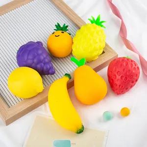 Set of fruit-shaped squishy stress relief toys including banana and strawberry