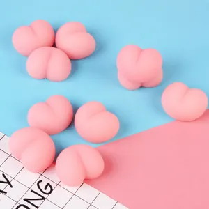 Cute pink peach butt-shaped squishy stress relief fidget toy, portable 4x3x1.5cm size