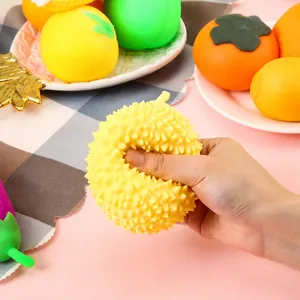 Detail view showing the soft texture of a durian-shaped squishy stress relief toy being squeezed