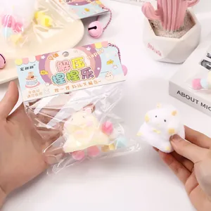 Close-up view of a soft fuzzy hamster squishy toy featuring cute stress relief packaging