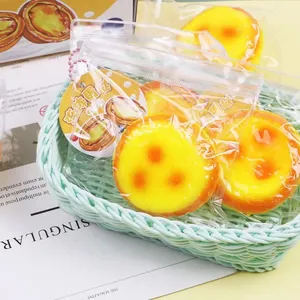 Detailed view of realistic egg tart squishy toys in packaging for stress relief
