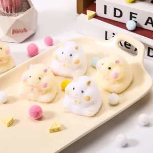 Fuzzy cute hamster stress relief squeeze toys on a decorative beige ceramic tray