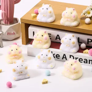 Close-up detail of cute fluffy hamster squishy toys in white and yellow colors for stress relief