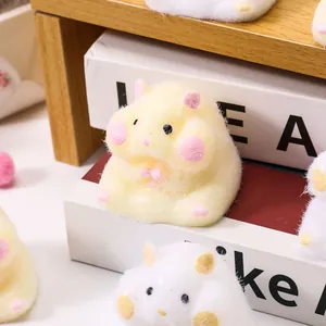 Close-up of fuzzy yellow hamster stress toy featuring soft TPR flocking and cute details