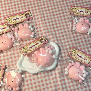 Detailed view of soft pink rabbit squishy stress relief toys in cute decorative packaging