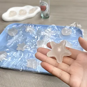 Close-up of star-shaped color-changing squishy stress relief toy held in hand