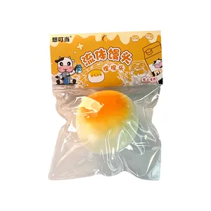 Soft milk bun shaped squishy toy in original cartoon packaging for stress relief