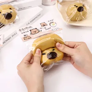 Detailed shot of hands squeezing a cute yellow capybara squishy toy for stress relief
