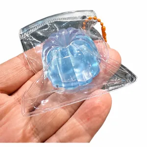 Glacier blue Cannelé-shaped squishy toy for stress relief in a clear portable bag