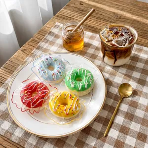 Lot de quatre jouets sensoriels en silicone en forme de donuts pour soulager le stress