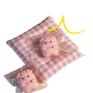 Cute pink pig food-grade silicone squishy toy for stress relief presented in clear packaging