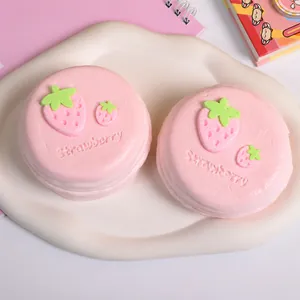Detail of pink strawberry souffle silicone squishy decompression toy on a plate