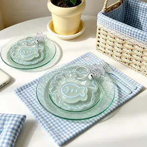 Close-up detail of transparent fish-shaped silicone squishy toys on decorative plates