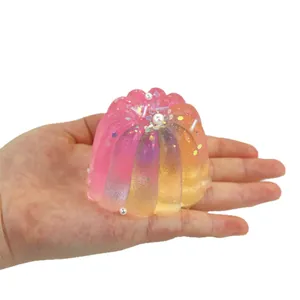Handheld colorful transparent pudding squishy toy with glitter and pearl details