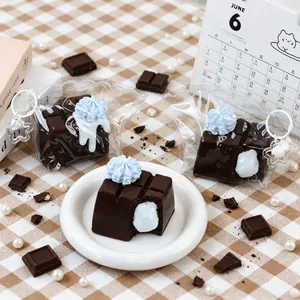 Detail view of chocolate-shaped silicone squishy toy with cream filling and star keychain