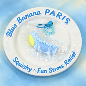 Detailed close-up view of a cute blue banana squishy stress relief toy on a white plate