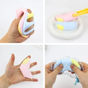 Detailed view of colorful banana-shaped silicone squishy toys being squeezed and held.