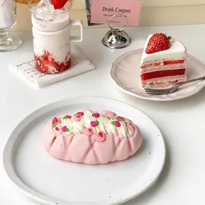 Close-up of strawberry cream cake squishy toy made of food-grade silicone