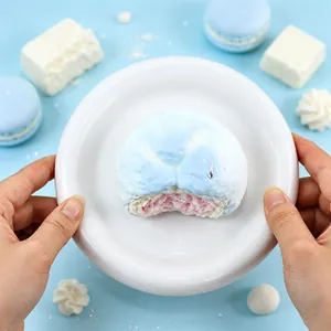 Detailed close-up of a bitten bread-shaped silicone squishy toy for stress relief