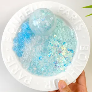 Close-up of sky blue silicone squishy toy components with star and moon glitter