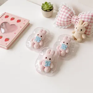 Drei süße rosa Kaninchen Squishy Spielzeuge mit blauen Schleifen in Spitzenfolie