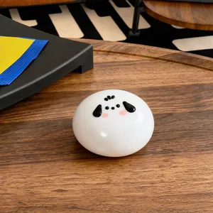 Close-up of a white puppy-faced squishy toy made of soft food-grade silicone