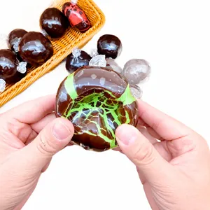 Weicher Schokoladen-Squishy-Ball Anti-Stress-Spielzeug mit grünem Rissmuster zur Entspannung