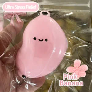 Close-up of pink cute banana squishy stress relief toy in plastic packaging bag