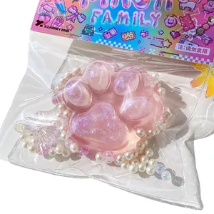 Giocattolo antistress zampa di gatto rosa glitterata con perle in confezione di plastica chiara