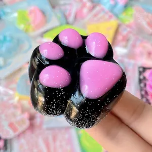 Adorable black and pink glittery cat paw squishy toy for effective stress relief