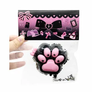 Kawaii pink and black cat paw squishy toy stress relief fidget sensory toy in packaging