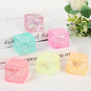 Detail shot of colorful translucent glitter ice cube squishy toys for stress relief