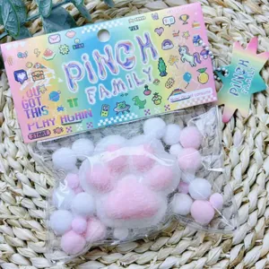 Detailed view of a soft pink flocked cat paw squishy toy in its vibrant packaging